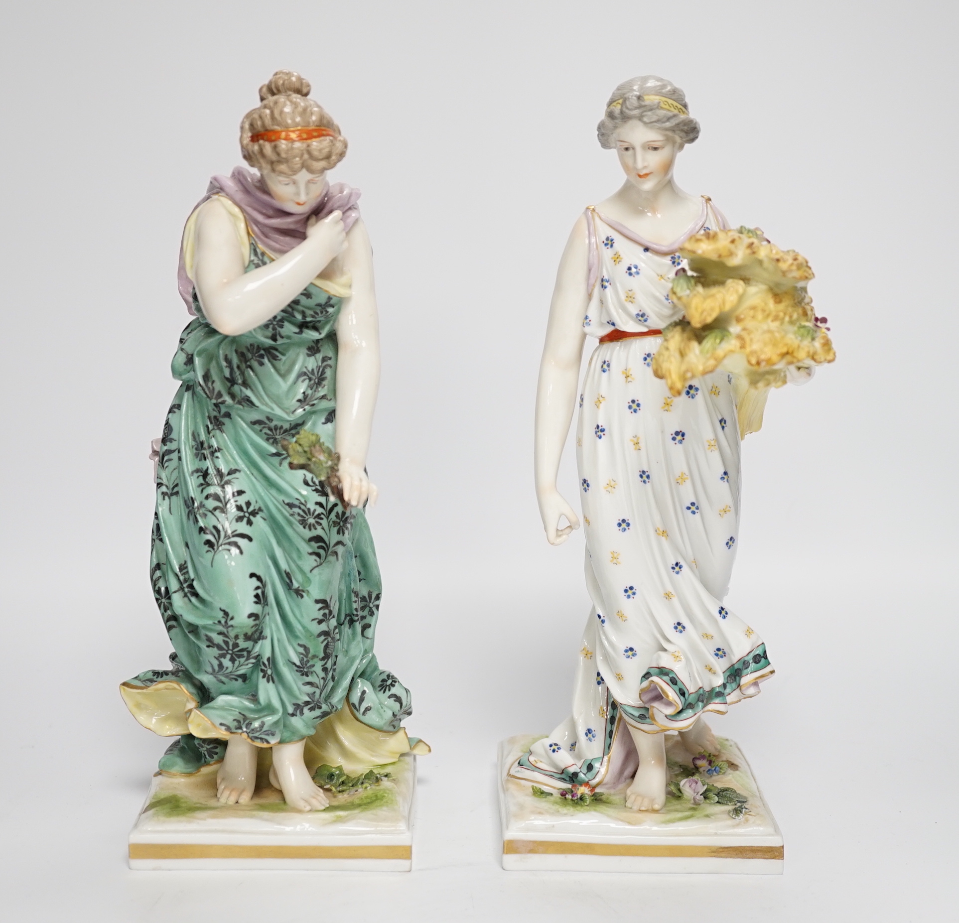 A pair of Frankenthal style porcelain female figures emblematic of summer and winter, 27.5cm